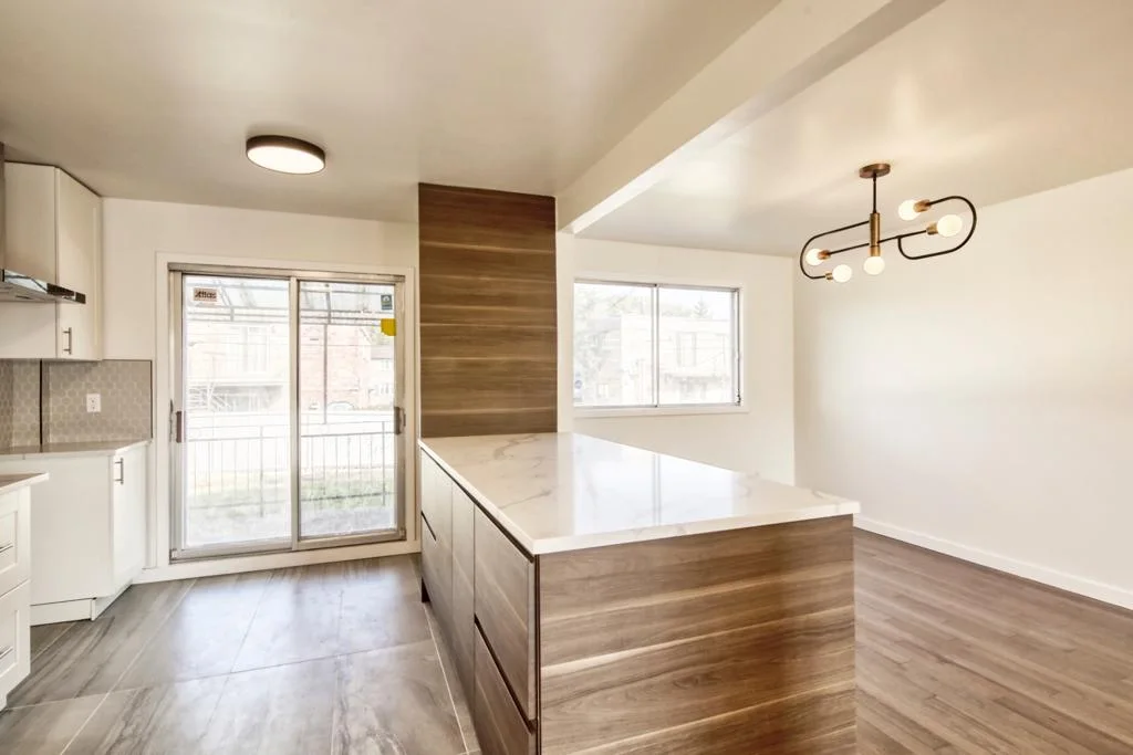 Kitchen island and patio doors leading to the deck