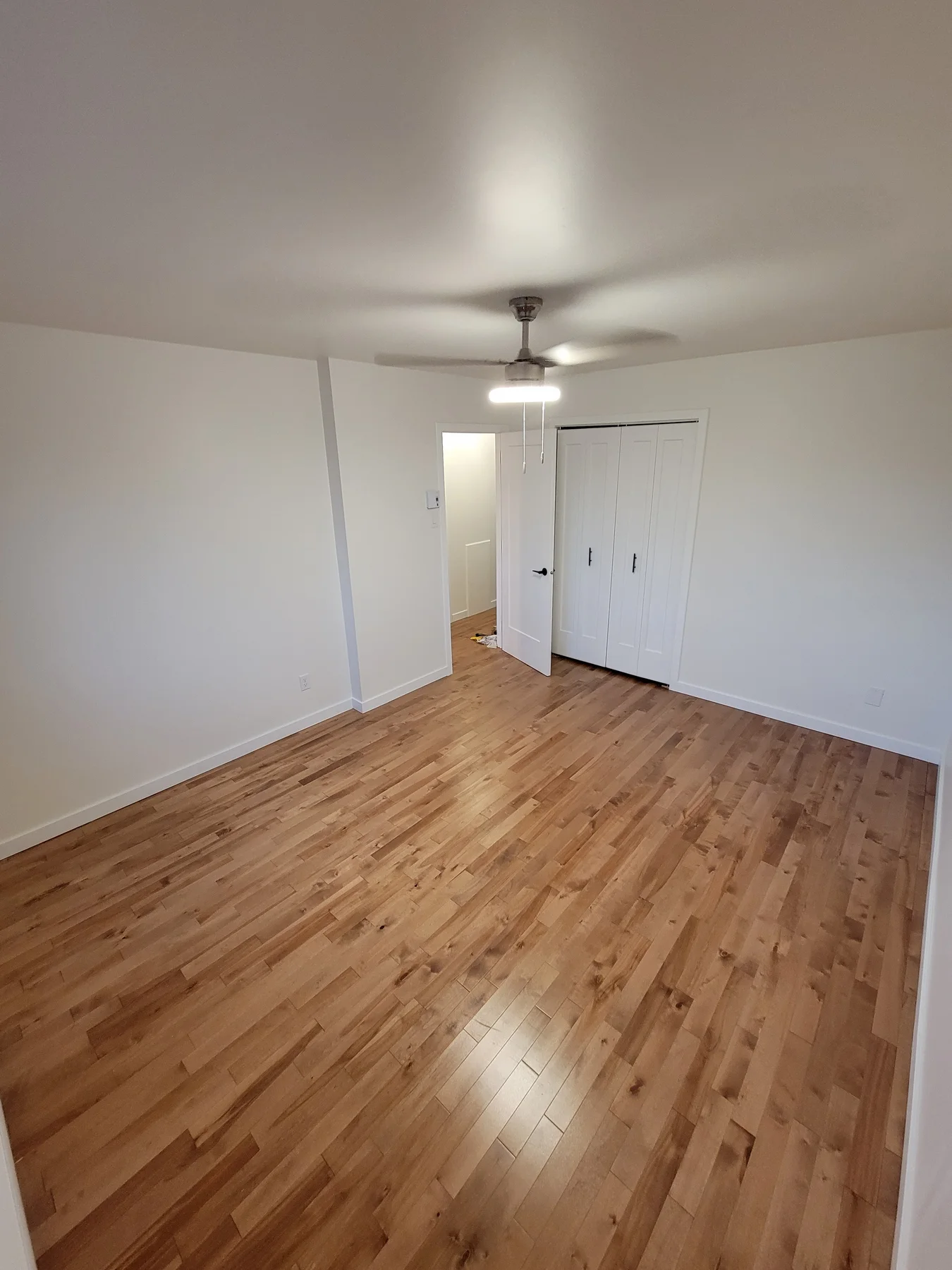 Bedroom with refinished hardwood floors