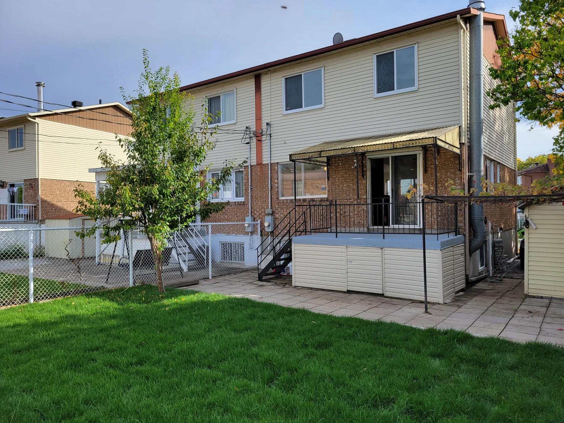 Rear façade, new deck and freshly sodded lawn
